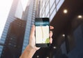 Hand Holding Phone With Navigation App Walking In Urban Area Royalty Free Stock Photo