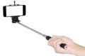 Hand holding phone selfie stick isolated with clipping path