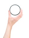 Hand holding photo ND filter. On white with clipping path Royalty Free Stock Photo