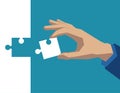 Hand holding piece of puzzle white. Concept business illustration. Vector flat