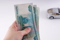 A hand holding a pile of thousand-dollar ruble notes. Russian cu Royalty Free Stock Photo