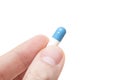 Hand holding pill Royalty Free Stock Photo