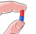 Hand holding pill Royalty Free Stock Photo