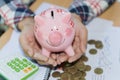 Hand holding pink piggy bank, Save money and financial investm