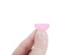 Hand holding pink pill Royalty Free Stock Photo