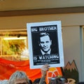 A hand holding a placard at a demonstration in Nelson against the New Zealand government`s GCSB bill