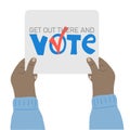 Hand holding placard with Get out there and vote text Royalty Free Stock Photo