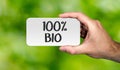 Hand holding placard with word ` 100% BIO`. BIO concept. Royalty Free Stock Photo