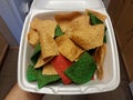 Hand holding plain and red and green tortilla chips Royalty Free Stock Photo