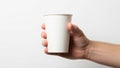 Positioned horizontally grasping the cup firmly and is of a light Royalty Free Stock Photo