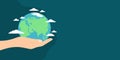 Hand holding planet Earth with clouds around on dark blue background with copy space. Vector illustration Royalty Free Stock Photo
