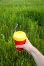 Hand holding plastic cup