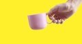 Hand holding plastic cup like a pouring Royalty Free Stock Photo