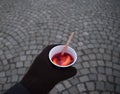 Hand  holding a plastic cup with SvaÃâ¢ÃÂ¡k on Prague Royalty Free Stock Photo