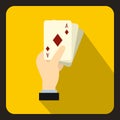 Hand holding playing cards icon, flat style