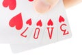 Hand holding playing cards spelling the word love Royalty Free Stock Photo