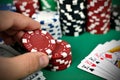 Hand holding poker chips Royalty Free Stock Photo