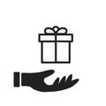 Hand holding present icon isolated. Giving christmas gifts icon. Isolated celebration symbol