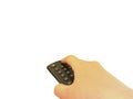 Hand holding and press power button on remote control isolated on white background Royalty Free Stock Photo