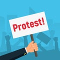 Hand holding protest signs on background crowd of people protesters. Protest, demonstration, riot, concept. Royalty Free Stock Photo