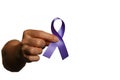 Hand holding purple ribbon on white background with copy space for text,fibromyalgia awareness, world cancer day Royalty Free Stock Photo