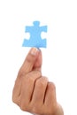 Hand holding puzzle piece Royalty Free Stock Photo