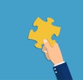 Hand holding puzzle piece Royalty Free Stock Photo