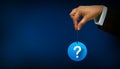 Hand holding Question mark concept on blue background Royalty Free Stock Photo