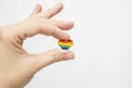 Hand holding rainbow gay pride symbol heart as lgbt rights concept, copy space Royalty Free Stock Photo