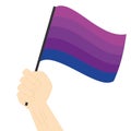 Hand holding and raising Transgender pride flag isolated on white background