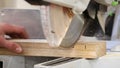 Circular saw up close cutting plank of timber