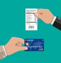 Hand holding receipt and credit card. Royalty Free Stock Photo