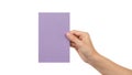 A hand holding a rectangular piece of purple paper against a white background Royalty Free Stock Photo