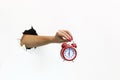 Hand holding a red alarm clock Royalty Free Stock Photo