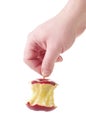 Hand holding a red apple core by the stalk Royalty Free Stock Photo