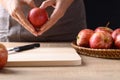 Hand holding red apple fruit with heart shape Royalty Free Stock Photo