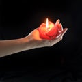 Hand holding red candle Royalty Free Stock Photo