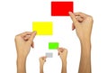 Hand holding a red card, a yellow card, a green card on a white background. Royalty Free Stock Photo