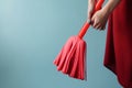 Hand holding red color mop cleaning. Generate Ai Royalty Free Stock Photo