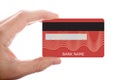 Hand holding red credit card isolated on white background Royalty Free Stock Photo