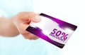 Hand holding red discount card isolated over white Royalty Free Stock Photo