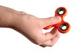 Hand holding red fidget spinner Royalty Free Stock Photo