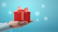 Hand holding red gift box on pastel blue background with copy space. give a special gift. 3d rendering Royalty Free Stock Photo