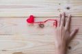 Hand holding red heart crochet knit