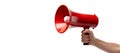 Hand holding red megaphone. Announce, advertise and proclaim concepts Royalty Free Stock Photo