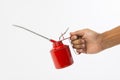 Hand holding red oil can Royalty Free Stock Photo