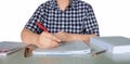 hand holding red pen over blurred paperwork Royalty Free Stock Photo