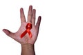 Hand holding red ribbon. Aids Awareness Sign Red Ribbon for World Aids Day concept . World Aids Day symbol for Aids campaigne - Royalty Free Stock Photo