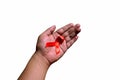 Hand holding red ribbon. Aids Awareness Sign Red Ribbon for World Aids Day concept . World Aids Day symbol for Aids campaigne - Royalty Free Stock Photo