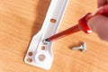 Hand holding a red screwdriver Royalty Free Stock Photo